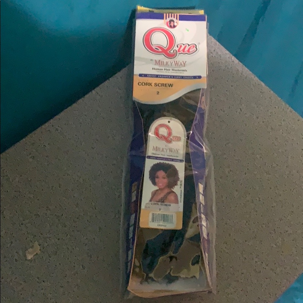 Que by milkway cork screw hair